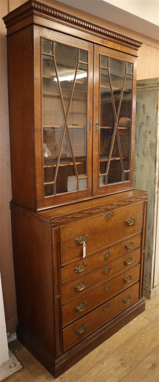 An oak secretaire bookcase W.98cm